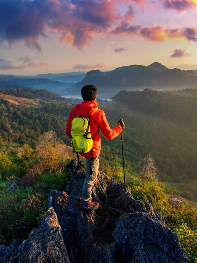 Backpacker standing on sunrise viewpoint at Ja Bo village, Mae h